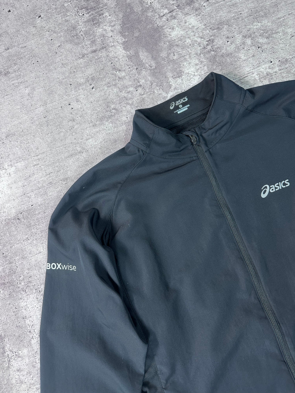 Cortaviento Asics